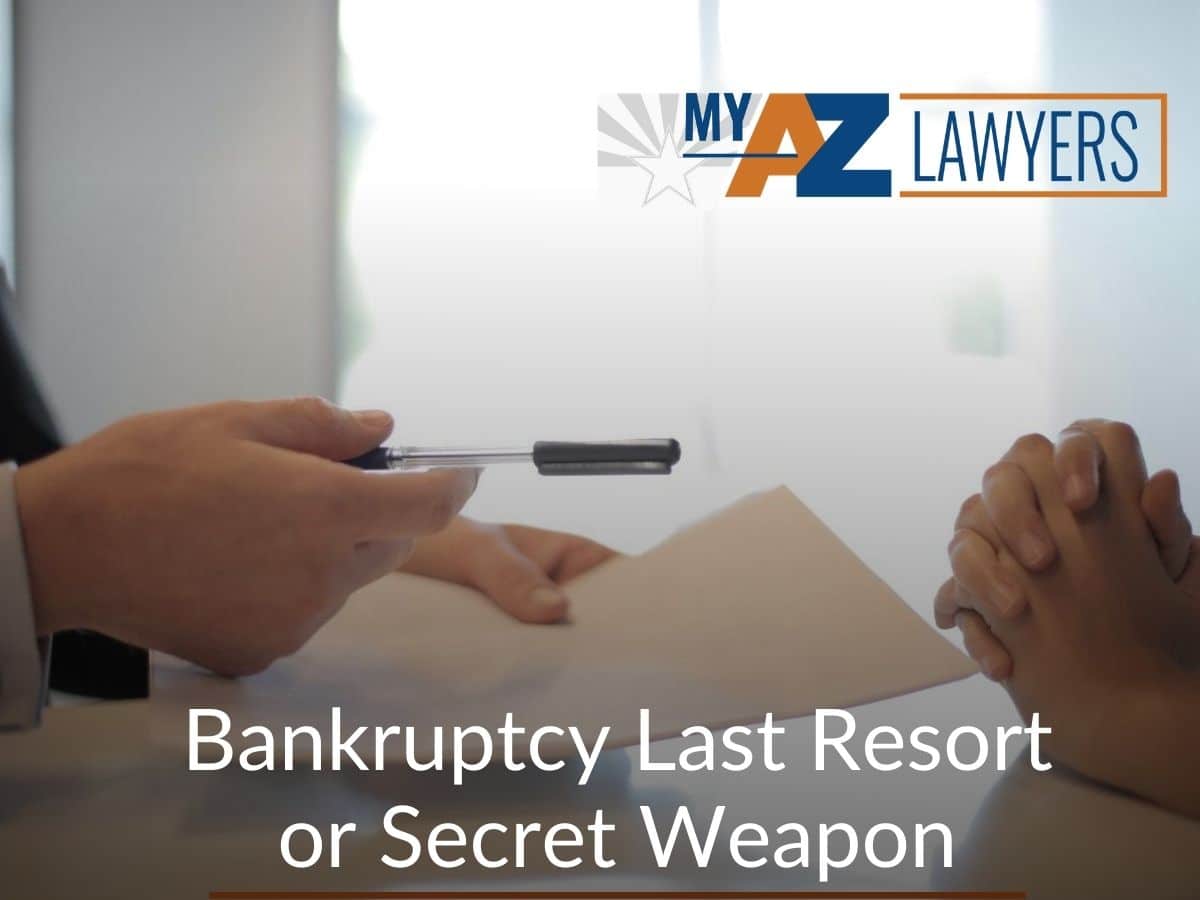 Man Holding a Pen Explaining to Other Person about Bankruptcy and The Benefits listed by My AZ Lawyers blog