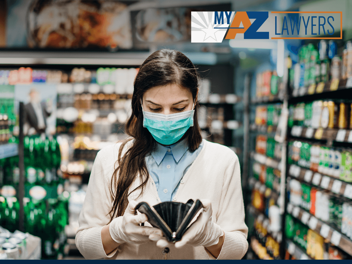 Worried woman checking her wallet in grocery store during covid 19 pandemic
