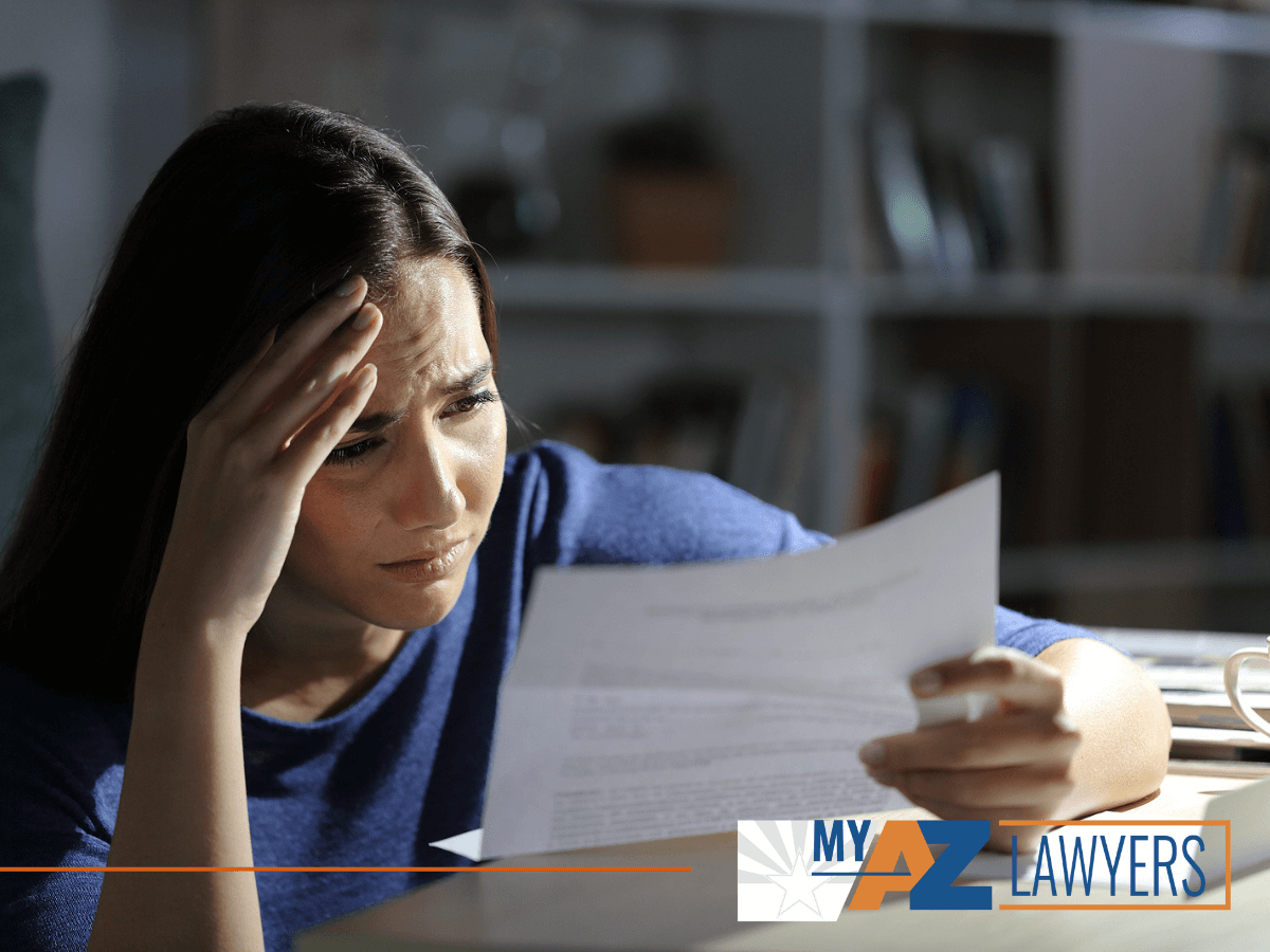 Worried woman reading a foreclosure notice