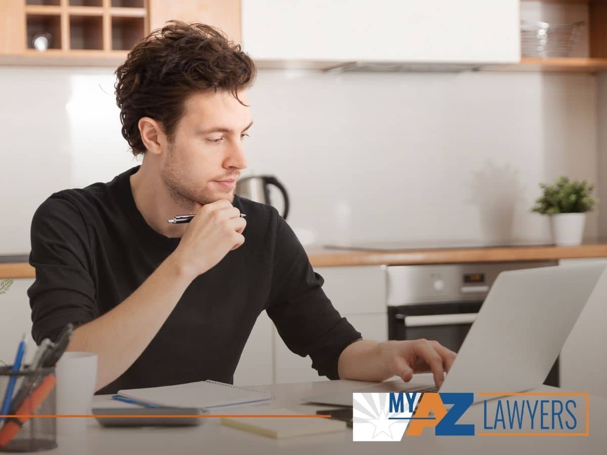 Divorced man reviewing his financial status and trying to become financially independent with tips from My AZ Lawyers blog