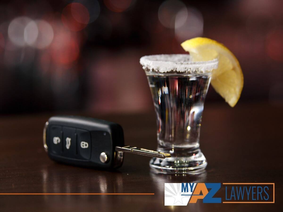 Shot of tequila and car keys of a repeat DUI Offender