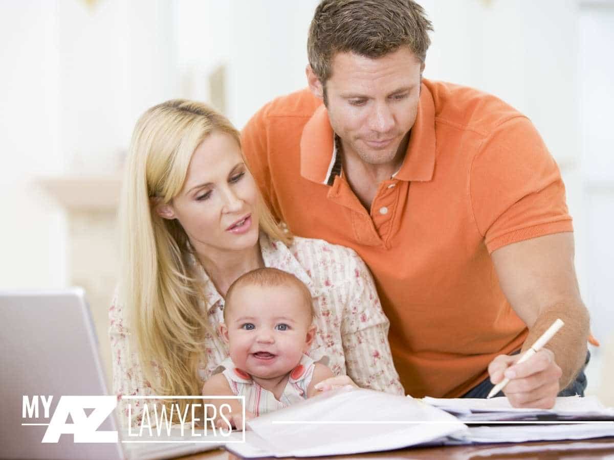 A family modifying their estate plan after the birth of their child in Mesa, AZ