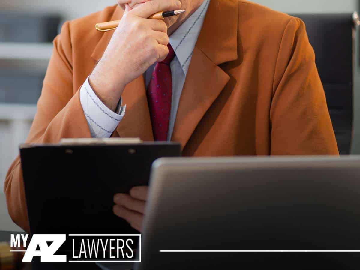 Attorney reviewing Chapter 13 Bankruptcy documents, ready to assist clients through the complexities of bankruptcy and divorce